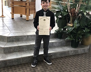 Neighbors | Submitted.Holy Family sixth-grade student Aidan Hryb proudly showed off his Beta Club certificate after being inducted into the National Junior Beta Club.on Jan. 28. .