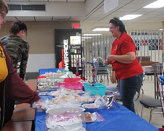 Neighbors | Jessica Harker.Band Parent Association volunteers worked the bake sale on Feb. 23 at the annual Spaghetti Dinner fundraiser.