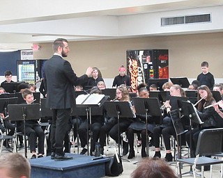 Neighbors | Jessica Harker.Middle School Band Director Jeremy McClaine directed students as they performed for community members during the annual Spaghetti Dinner at Austintown Fitch High School.