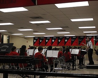 Neighbors | Abby Slanker.Under the direction of James Volenik (right), the Canfield Village Middle School eighth-grade band performed at the Canfield Band Parents annual Pasta Dinner on Feb. 23.