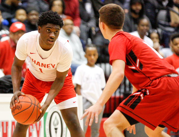 Chaney's Jamison Tubbs looks to pass the ball while Girard's Adam Connelly tries to block him during their game at Chaney High School on Friday night. EMILY MATTHEWS | THE VINDICATOR