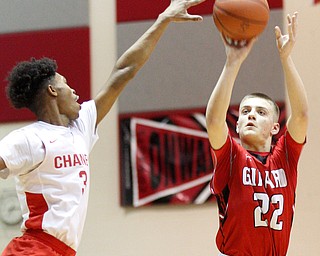 Girard's Christian Graziano shoots the ball while Chaney's Marquel Gillespie tries to block him during their game at Chaney High School on Friday night. EMILY MATTHEWS | THE VINDICATOR