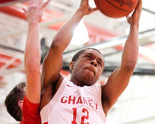 Chaney's Jamelin Love catches a rebound during their game against Girard at Chaney High School on Friday night. EMILY MATTHEWS | THE VINDICATOR