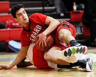 Girard's Austin Claussell tries to hold onto the ball while he and Chaney's Jamison Tubbs fall to the ground during their game at Chaney High School on Friday night. EMILY MATTHEWS | THE VINDICATOR