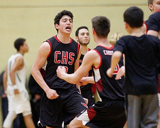 Canfield's Conor Crogan celebrates with his team after beating Ursuline at Ursuline High School on Friday night. EMILY MATTHEWS | THE VINDICATOR