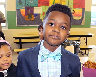 Third-grade students at Warren's Willard Pre-K to Grade 8 School celebrated Black History Month Friday by presenting information on famous black Americans to their classmates, teachers and parents. Ta-shawn Fambro portrays former President Barack Obama.