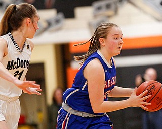 Western Reserve's Alyssa Serensky drives the ball while McDonald's Maddy Howard runs after her during their game at Mineral Ridge High School on Saturday afternoon. EMILY MATTHEWS | THE VINDICATOR