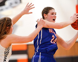 Western Reserve's Danni Vuletich looks to pass the ball while McDonald's Molly Howard tries to block her during their game at Mineral Ridge High School on Saturday afternoon. EMILY MATTHEWS | THE VINDICATOR