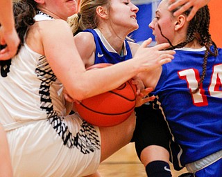 From left, McDonald's Sophia Costantino and Western Reserve's Madison Owen and Kennedy Miller battle for the ball during their game at Mineral Ridge High School on Saturday afternoon. EMILY MATTHEWS | THE VINDICATOR