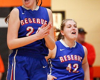 Western Reserve's Danni Vuletich, left, and Morgan Donithan celebrate after beating McDonald at Mineral Ridge High School on Saturday afternoon. EMILY MATTHEWS | THE VINDICATOR