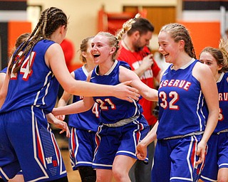 Western Reserve's Olivia Pater, center, Alyssa Serensky, right, and Danni Vuletich, left, celebrate with the rest of their team after beating McDonald at Mineral Ridge High School on Saturday afternoon. EMILY MATTHEWS | THE VINDICATOR