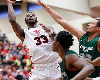 YSU's Naz Bohannon shoots the ball while CSU's Jaalam Hill reaches out to try to block him during their game on Saturday night. EMILY MATTHEWS | THE VINDICATOR