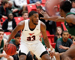 YSU's Naz Bohannon looks to pass the ball while CSU's Deante Johnson tries to block him during their game on Saturday night. EMILY MATTHEWS | THE VINDICATOR