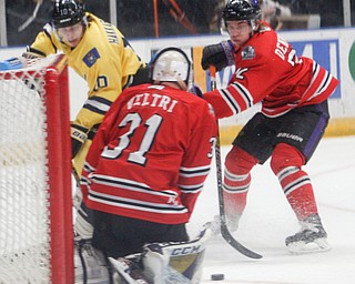Phantoms' goaltender Chad Veltri protects the net while Liam Dennison and Lumberjacks' Mikael Hakkarainen battle for the puck during their game in the Covelli Centre on Sunday night. EMILY MATTHEWS | THE VINDICATOR