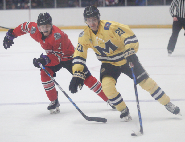 Phantoms'  Aiden Gallacher tries to get the puck away from Lumberjacks' Ryan Savage during their game in the Covelli Centre on Sunday night. EMILY MATTHEWS | THE VINDICATOR