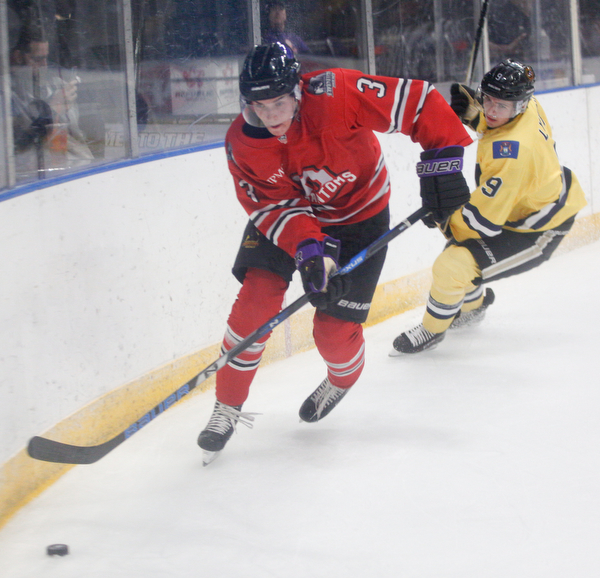 Phantoms' Jeppe Urup  tries to keep the puck away from Lumberjacks' Bobby Lynch during their game in the Covelli Centre on Sunday night. EMILY MATTHEWS | THE VINDICATOR