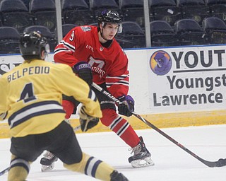 Phantoms' Matt DeMelis carries the puck while trying to keep it from Lumberjacks' Nic Belpedio during their game in the Covelli Centre on Sunday night. EMILY MATTHEWS | THE VINDICATOR