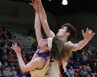 Drew Clark (2) of Springfield blocks a shot attempt by Sebringâ€™s Zane Peterson (23) during Monday nights district matchup at Struthers High School. Dustin Livesay  |  The Vindicator  3/4/19  Struthers.