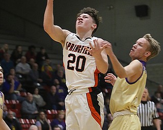 Springfieldâ€™s Beau Brungard (20) draws a foul while driving to the hoop past Sebringâ€™s Joey Clark during the first half of Monday nights district matchup at Struthers High School. Dustin Livesay  |  The Vindicator  3/4/19  Struthers.