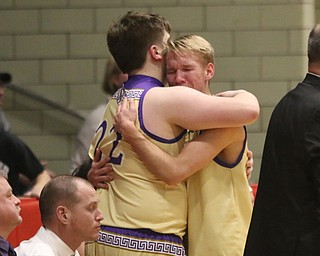 Sebring’s Joey Clack (right) and Matt Byrd (left) embrace as time runs out in the fourth quarter of Monday nights district matchup against Springfield at the Struthers Fieldhouse in Struthers.   Dustin Livesay  |  The Vindicator  3/4/19  Struthers.