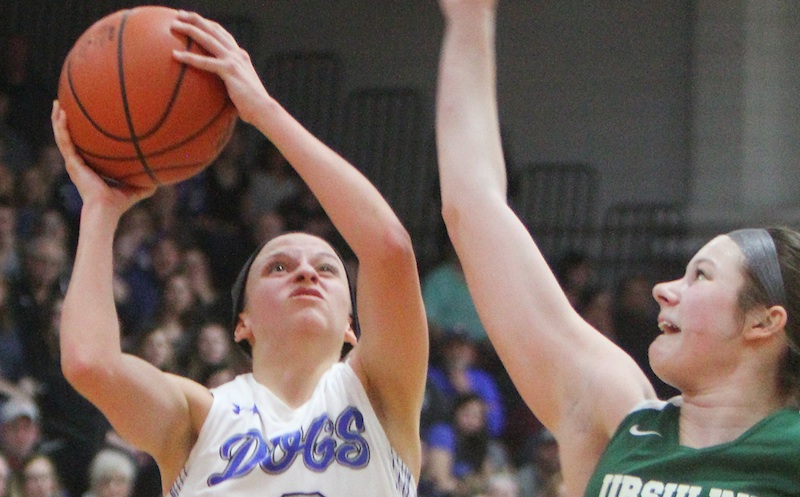 Poland’s Sarah Bury (2) shoots past Ursuline’s Lindsay Bell (35) during the Bulldogs’ district championship game on Thursday at Austintown Fitch High School. Bury is one of four seniors on Poland’s first regional team in 19 seasons.