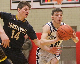 William D. Lewis The Vindicator  McDonald's Josh Celli(10) passes around Lowellville's Matt Hvisdak(14).