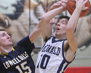 William D. Lewis The Vindicator  McDonlad's Josh Celli (10) tries to shoot over Lowellville's Jake rotz(15).