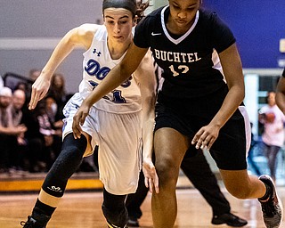 DIANNA OATRIDGE | THE VINDICATOR  Poland's  Jackie Grisdale (21) and Akron Buchtel's Kanai Chance (12) reach for a loose ball during the Division II Girls Regional Semi-final in Barberton on Tuesday.