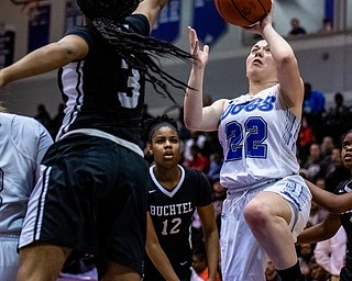 DIANNA OATRIDGE | THE VINDICATOR  Poland's Kat Partika (22) puts up a shot over Akron Buchtel's Leah Cheatham (3) during the Division II Girls Regional Semi-final in Barberton on Tuesday.