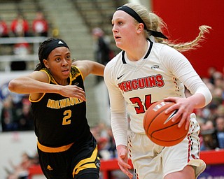 YSU's McKenah Peters drives the ball while Milwaukee's Akaylah Hayes runs after her during their game at Beeghly Center on Wednesday night. EMILY MATTHEWS | THE VINDICATOR