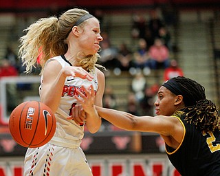 Milwaukee's Akaylah Hayes hits the ball out of the hands of YSU's Melinda Trimmer during their game at Beeghly Center on Wednesday night. EMILY MATTHEWS | THE VINDICATOR