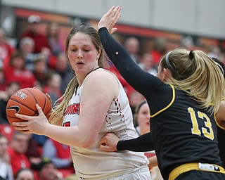 YSU's Mary Dunn tries to get the ball past Milwaukee's Brandi Bisping during their game at Beeghly Center on Wednesday night. EMILY MATTHEWS | THE VINDICATOR