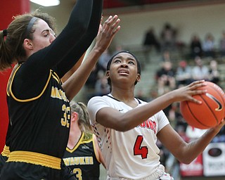 YSU's Deleah Gibson tries to shoot the ball while Milwaukee's Megan Walstad (33) and Ryaen Johnson try to block her during their game at Beeghly Center on Wednesday night. EMILY MATTHEWS | THE VINDICATOR