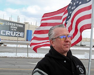 William D. Lewis The Vindicator Mark Franko of Cortland anda 28 year employee ofGM Lordstown holds  flg outside the plant 3-6-19 after  the last Cruze rolled off the line.