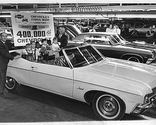 Nov. 13, 1969: GM celebration. Children of General Motors employees born about the time the first Chevrolet came off the Lordstown assembly line in April 1966, were on hand this morning as the 400,000th passenger car rolled the the production line. Left to right are V.P Sutt, production manager at the Fisher Body assembly unit; Georgeann, 1844 N. Ellsworth Ave.,  Salem; Richard M. Calvaruso, 2316 Inwood Ave., Austintown; Tavia A. Kelley, 153 Woodbine Ave., Struthers; James Kuzman, 1682 Trumbull Road, Girard; Ruth Ann Ousley, 410 Negley Ave., Farrell, Pa.; Brenda M. Robinson, 3609 Plumbrook Drive, Canfield, and Louis J. Biskach, manager of the Chevrolet plant.