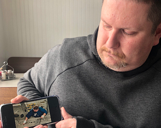 Jason Markovich, who’s worked at #GMLordstown since 1999, shows a photo of himself working on the plant’s last Chevy Cruze, which is expected to roll off the assembly line today. @vindicator