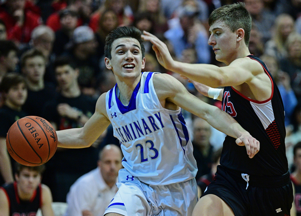 BOARDMAN, OHIO - MARCH 6, 2019: Poland's Michael Cougras drives on Canfield's Joe Bruno during the first half of their OHSAA Tournament game, Wednesday night at Boardman High School. DAVID DERMER | THE VINDICATOR