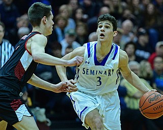 BOARDMAN, OHIO - MARCH 6, 2019: Poland's Braeden O'Shaughnessy drives on Canfield's Aydin Hanousek during the second half of their OHSAA Tournament game, Wednesday night at Boardman High School. DAVID DERMER | THE VINDICATOR