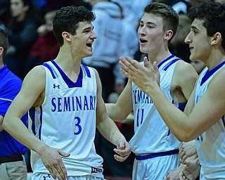 BOARDMAN, OHIO - MARCH 6, 2019: Poland's Braeden O'Shaughnessy, left, celebrates on the bench after being removed from the game with Collin Todd during the second half of their OHSAA Tournament game, Wednesday night at Boardman High School. DAVID DERMER | THE VINDICATOR.