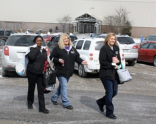 These three GM Lordstown workers left the plant together at the end of their final shift Wednesday. They are, from left, Brenda Grooms and sisters Lisa Hines and Marcie Natal. "We're down but don't count us out," Grooms said of her mood about the loss of her job.