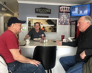 Lordstown Mayor Arno Hill, right, talks with a patron and an employee at Nese's Diner about the pending closure of the General Motors Assembly Plant after the last Chevrolet Cruze rolls of the line.