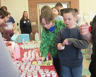 Neighbors | Jessica Harker .Boardman hosted its first milk taste testing event, bringing samples of strawberry, cotton candy and cookies and cream milk to Glenwood Junior High School from Bakers Golden Dairy Feb. 4.
