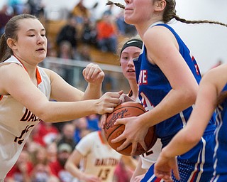 Western Reserve's Danni Vuletich looks to the hoop while Dalton's Tess Denning reaches for the ball during their game at Perry High School in Massillon on Thursday evening. EMILY MATTHEWS | THE VINDICATOR