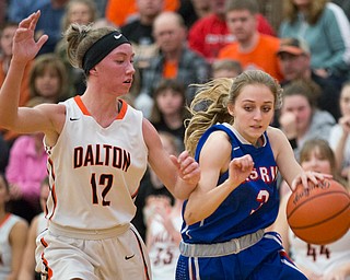 Western Reserve's Madison Owen drives the ball while Dalton's Emma Cannon tries to block her during their game at Perry High School in Massillon on Thursday evening. EMILY MATTHEWS | THE VINDICATOR