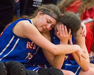 Western Reserve's Kennedy Miller, left, embraces Erica Dezee during the fourth period of their game against Dalton at Perry High School in Massillon on Thursday evening. Western Reserve lost 32-53. EMILY MATTHEWS | THE VINDICATOR