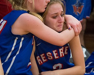 Western Reserve's Olivia Pater, left, embraces Madison Owen during the fourth period of their game against Dalton at Perry High School in Massillon on Thursday evening. Western Reserve lost 32-53. EMILY MATTHEWS | THE VINDICATOR