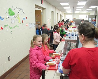 Neighbors | Jessica Harker.Students at Austintown Elementary School are pictured ordering lunch on March 1, selecting from unique options based on Dr. Seuss's books, in celebration of his birthday.