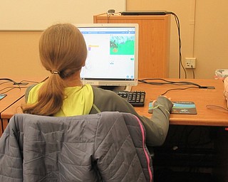 Neighbors | Jessica Harker.Girls meet once per month at the Main library for the free Girls Who Code program, where students grades 6-12 are able to complete 12 weeks of coding lessons.