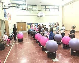 Neighbors | Jessica Harker.Third and fourth graders at Stadium Drive Elementary participate in the after school program Drums Alive Feb. 26 led by instructor Melony Angiuli.