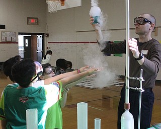 Neighbors | Abby Slanker.Parent volunteer Tim Styranec performed several dry ice experiments for third-grade students during C.H. Campbell Elementary School’s annual STEM Week on Feb. 28.